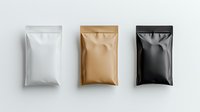 Three blank foil pouches in white, gold, and black colors arranged in row on light background, mockup for product packaging design and branding presentation.