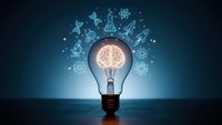 Glowing light bulb with brain inside surrounded by floating science and technology icons on blue background representing innovation and creativity.