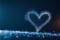 Magical glowing heart shape formed by sparkling particles floating above blurred bokeh surface in deep blue and pink tones, romantic atmosphere.