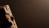 Bloody axe with dark stains against moody brown background for horror thriller mystery crime scene Halloween concept with dramatic lighting and copy space.
