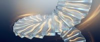 Abstract metallic spiral staircase with golden lighting effects creating dramatic architectural curves and reflective surfaces for modern design projects.
