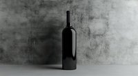 Black wine bottle casting dramatic shadow on concrete wall background, minimalist composition in monochrome style for luxury product photography and design.