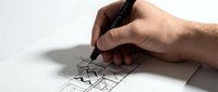 Hand of a male architect sketching geometric building blueprint with a black pen on white paper, showcasing creative design process.