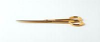 Elegant gold-toned scissors with elongated handles isolated on white background, ready for design projects, crafts, sewing, and decorative applications.