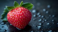 Fresh ripe strawberry with water drops on dark background, macro shot showing detailed texture and seeds, dramatic lighting for food photography.