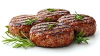 Grilled beef patties with fresh rosemary sprigs on white background, juicy meat with char marks and aromatic herbs for restaurant menu or cooking design.
