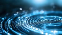 Glowing blue spiral pattern with light effects and bokeh circles on dark background creates futuristic technological atmosphere for modern design projects.