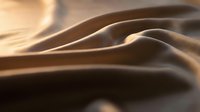 Smooth beige fabric with soft folds and warm lighting, showcasing texture and drape for textile, fashion, and design projects.