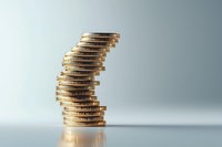 Unstable stack of golden coins on light background symbolizing financial risk, economic uncertainty and investment volatility in business concept.
