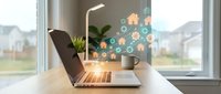 Modern laptop displaying smart home automation icons on wooden desk by window with residential neighborhood view for technology and connectivity concepts.
