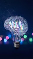 Creative brain lightbulb with glowing neural networks against starry night sky background with colorful bokeh lights for innovation and idea concepts.
