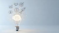 Glowing light bulb with business icons representing innovation, creativity, and entrepreneurial success on clean background for presentations.