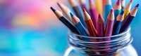 Colorful wooden pencils standing in glass jar against vibrant blurred blue and pink bokeh background, creative art supplies for drawing and coloring.
