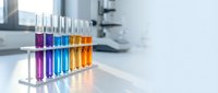 Colorful test tubes with chemical solutions in laboratory rack for scientific research and analysis experiments in modern lab setting.