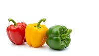 Fresh colorful bell peppers red yellow green isolated on white background for healthy cooking and nutrition concepts.