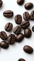 Roasted coffee beans scattered on white background showing rich brown texture and natural cracks for cafe branding and beverage marketing materials.