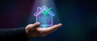 Businessman holding glowing neon house icon with 2027 text, representing future real estate investment, property development, and smart home technology concepts.