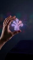 Hand holding glowing digital tree circuit symbol with neon purple pink lights representing growth technology innovation and artificial intelligence concepts.