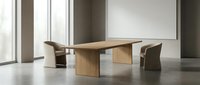Modern wooden conference table with leather chairs in minimalist office boardroom with large windows and neutral decor for corporate meetings.