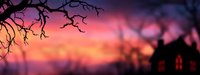 Spooky panoramic silhouette of haunted house and bare tree branches against dramatic purple and orange sunset sky. Halloween atmospheric background.