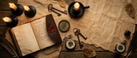 Vintage explorer's desk with antique compass, old maps, candles, and navigation instruments creating atmospheric adventure scene for historical storytelling projects.