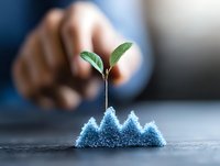 Young green sprout growing from blue crystal formation against dark background, symbolizing growth, innovation and sustainable development.