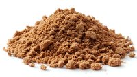 Ground cinnamon powder pile with fine texture and rich brown color on white background, isolated macro shot for culinary and spice packaging designs.