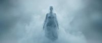 Ethereal ghostly figure emerging from misty clouds in atmospheric fog, supernatural apparition for horror, fantasy, and paranormal themed projects.