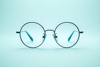 Round metal frame glasses with clear lenses isolated on mint green background, minimalist style eyewear for optical and vision care marketing.