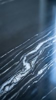 Abstract blue marble texture with flowing white veins and natural stone patterns for luxury interior design and sophisticated backgrounds.