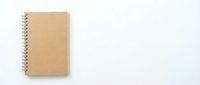 Spiral-bound notebook with kraft paper cover on white background, suitable for stationery, office supplies, education, and branding mockups.