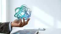 Businessman holding glowing turquoise digital sphere with interconnected lines, representing global network, technology, and data connectivity for business solutions.