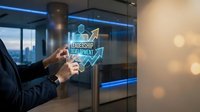 Professional businessman touching holographic leadership development interface in modern office with city skyline view and digital technology overlay.