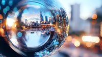 Modern cityscape reflected in glass sphere with bokeh lights creating dreamy urban perspective, skyscrapers and architecture captured through crystal ball photography.