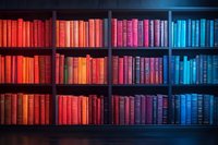 Colorful rainbow gradient bookshelf with vintage books arranged by color from warm red to cool blue tones on dark wooden shelves in library setting.