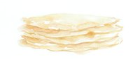 Stack of thin crepes or pancakes with golden-brown edges, suitable for food photography, culinary blogs, restaurant menus, and breakfast-themed designs.
