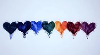 Colorful watercolor hearts in rainbow sequence with splashes and drips on white background, artistic love symbols for greeting cards and romantic designs.