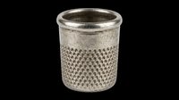 Silver metal thimble with textured knurled body, isolated on transparent background. Ready for sewing clipart, craft stickers, print on demand, and t-shirt design use.