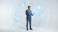 Professional businessman in suit using tablet surrounded by digital network sphere with glowing connections for technology and business concepts.