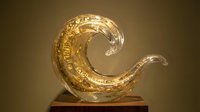 Elegant glass wave sculpture with golden accents on a wooden base, showcasing intricate craftsmanship and luxury art design for decor.