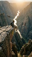 Hiker sitting on rocky cliff edge overlooking winding river through deep canyon valley at golden hour sunrise, adventure and exploration concept for travel and outdoor lifestyle.