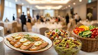 Elegant catering spread with gourmet appetizers and fresh salads at upscale event venue for corporate meetings, weddings, and special occasions.