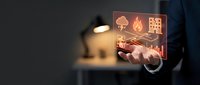 Businessman touching digital interface with fire, graph, and chart icons for risk management and financial analysis strategy.