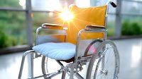 Empty wheelchair with yellow backrest and blue cushion in hospital corridor with sunlight streaming through window, symbolizing hope and recovery in healthcare.