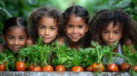 Four smiling African American and Hispanic children peeking over fresh garden tomatoes and herbs, representing healthy eating, gardening education and diversity.