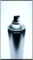 Metallic spray paint can with white foam residue on cap, isolated on white background for design and creative projects.