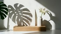 Elegant thank you card on wooden stand with white lily vase and monstera leaf shadow, minimal style for greeting and branding.