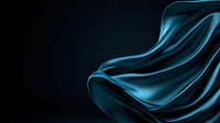 Luxurious flowing blue silk fabric with elegant waves and folds against dark background creates dramatic lighting effect and smooth texture for fashion design.