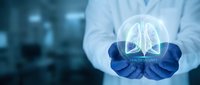 Doctor in white coat and blue gloves holding glowing lungs hologram, representing respiratory health, medical technology, and healthcare innovation in modern medicine.