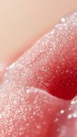 Macro close-up of glossy lips with water droplets and moisture creating a dewy, sparkly effect on red lipstick. Suitable for beauty and cosmetic advertising.